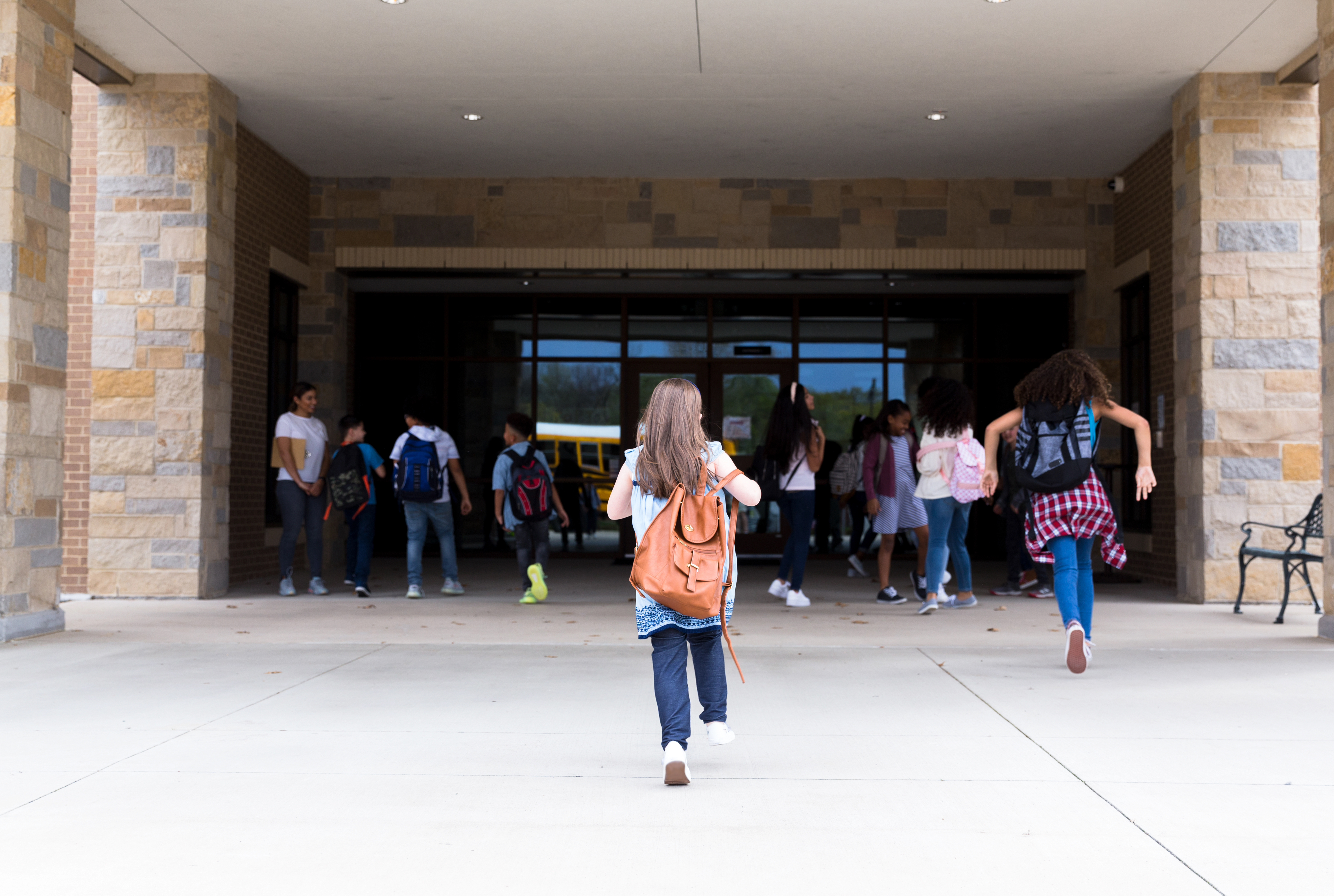 Students walking up to school building