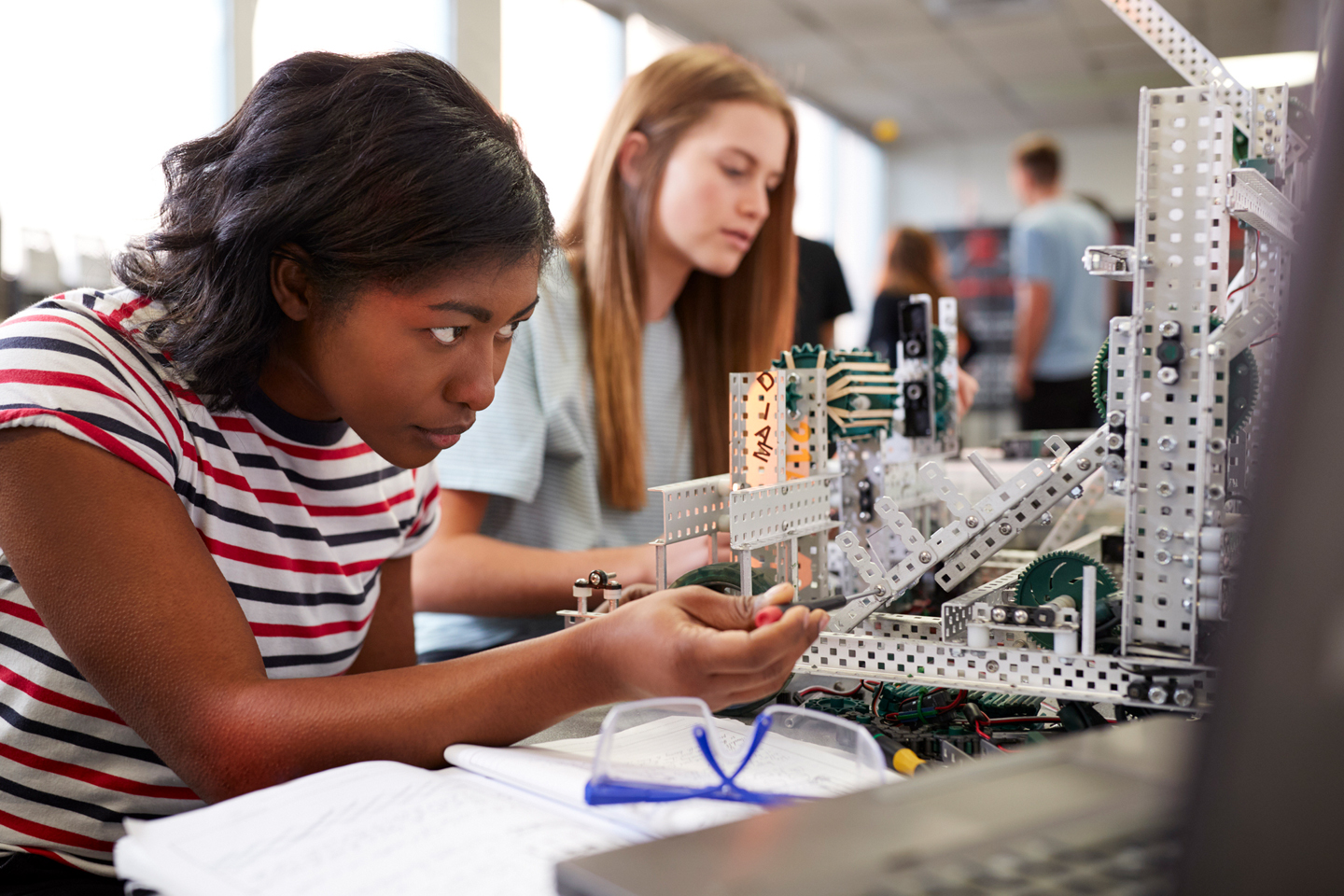 Students working on mechanics