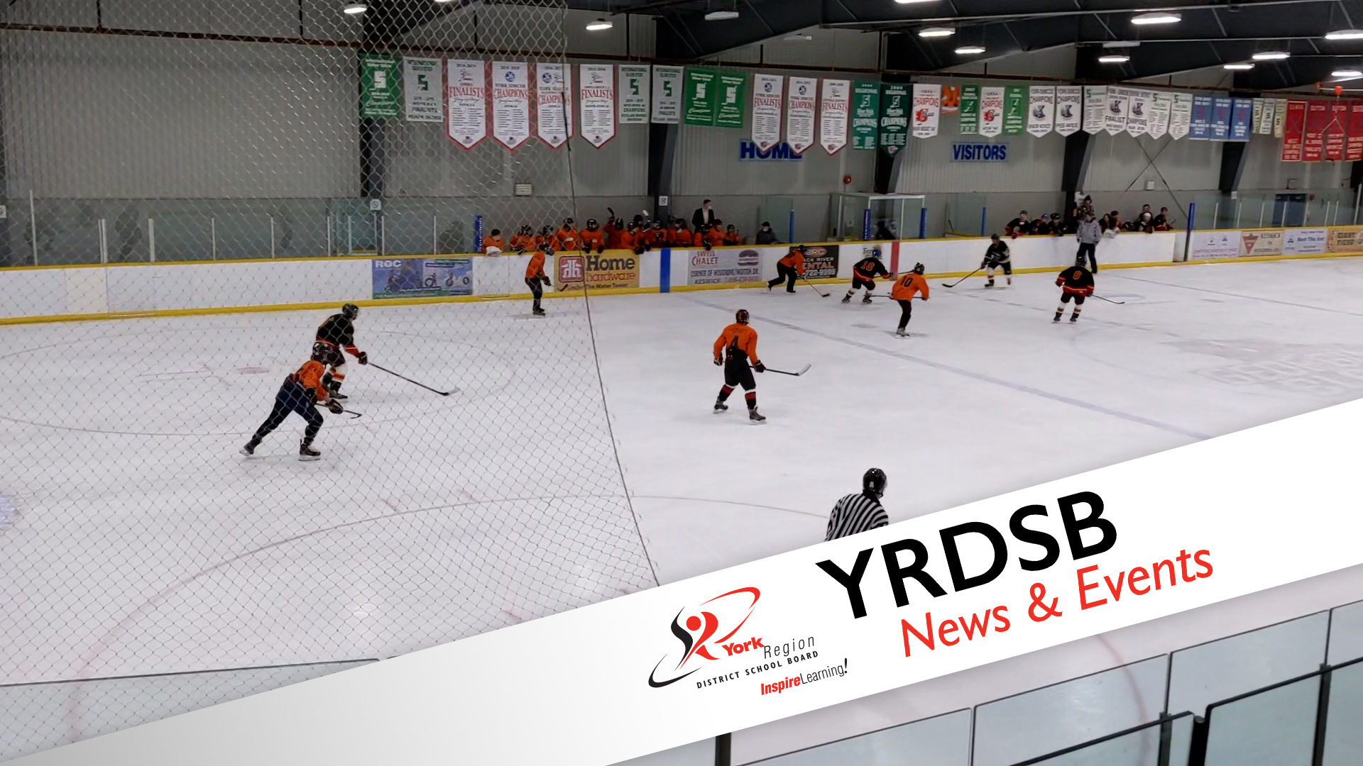 Hockey players playing ice hockey in indoor arena