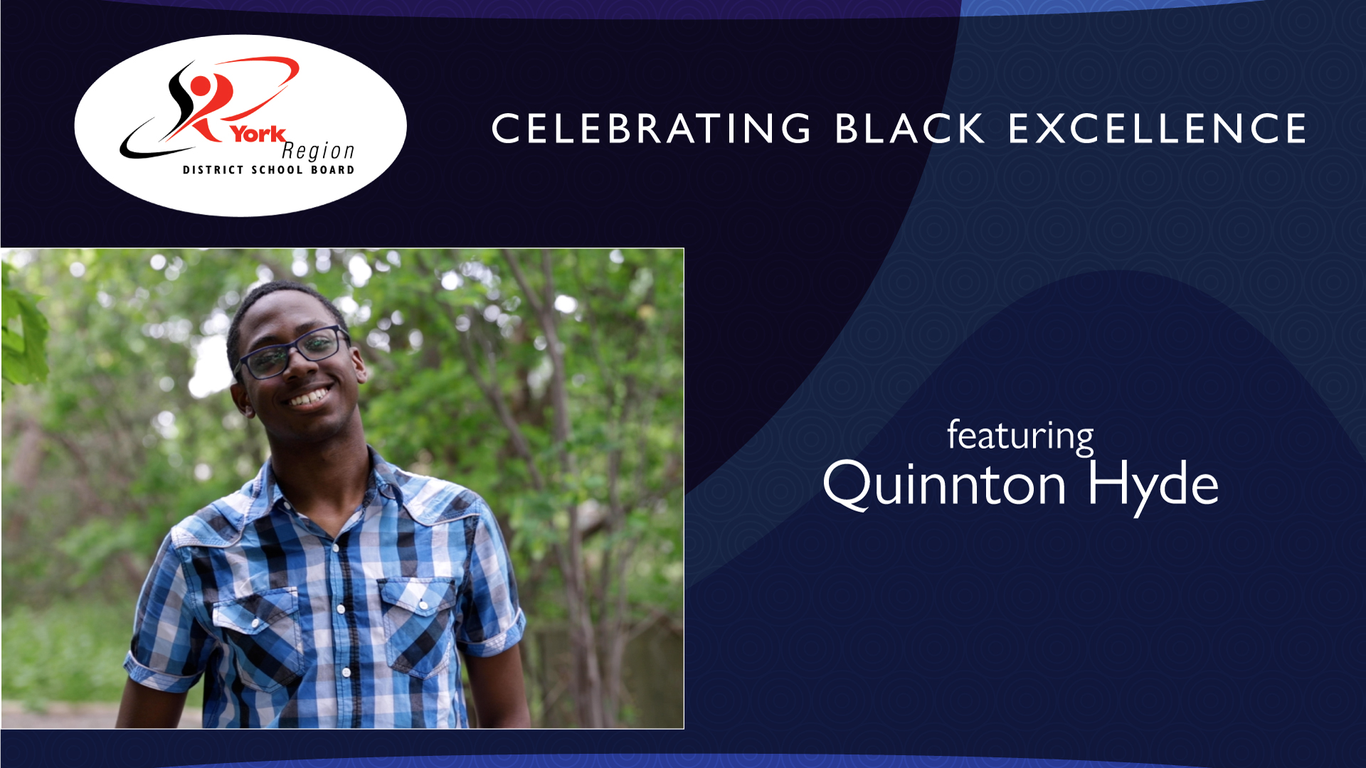 Quinton Hyde standing in front of trees smiling