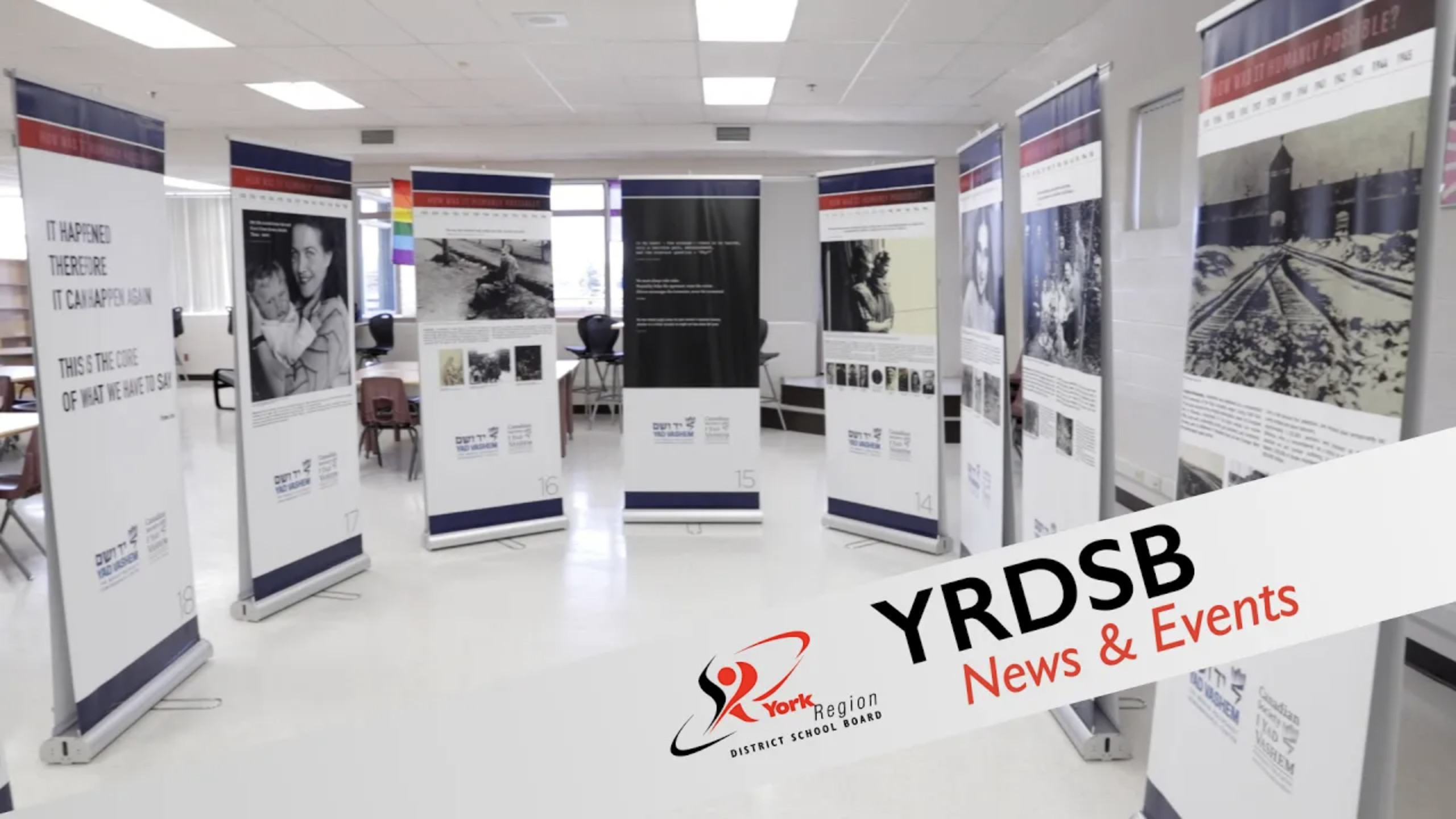 semi-circle of stand-up banners displaying information about the holocaust