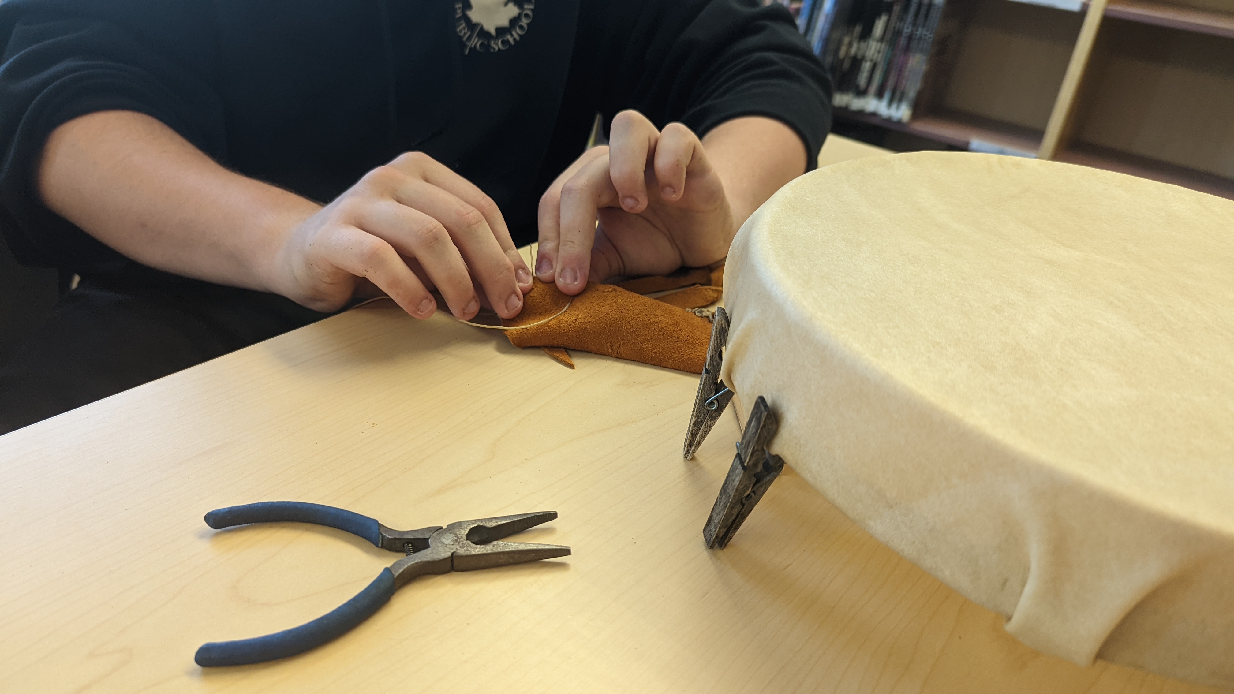 Student making hand drum