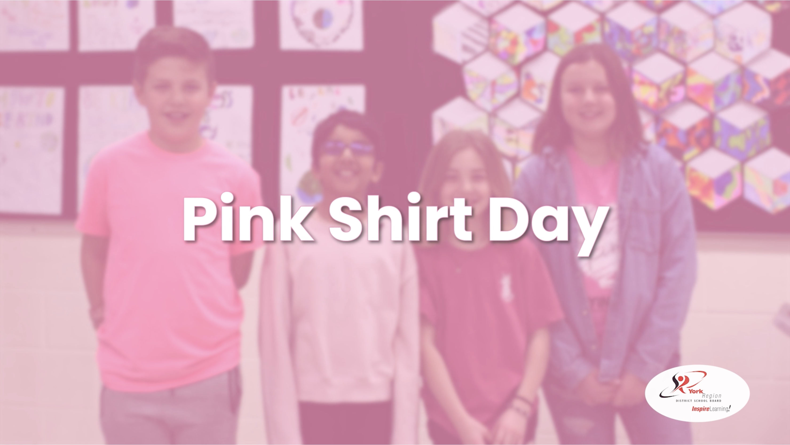 Four students in pink shirts