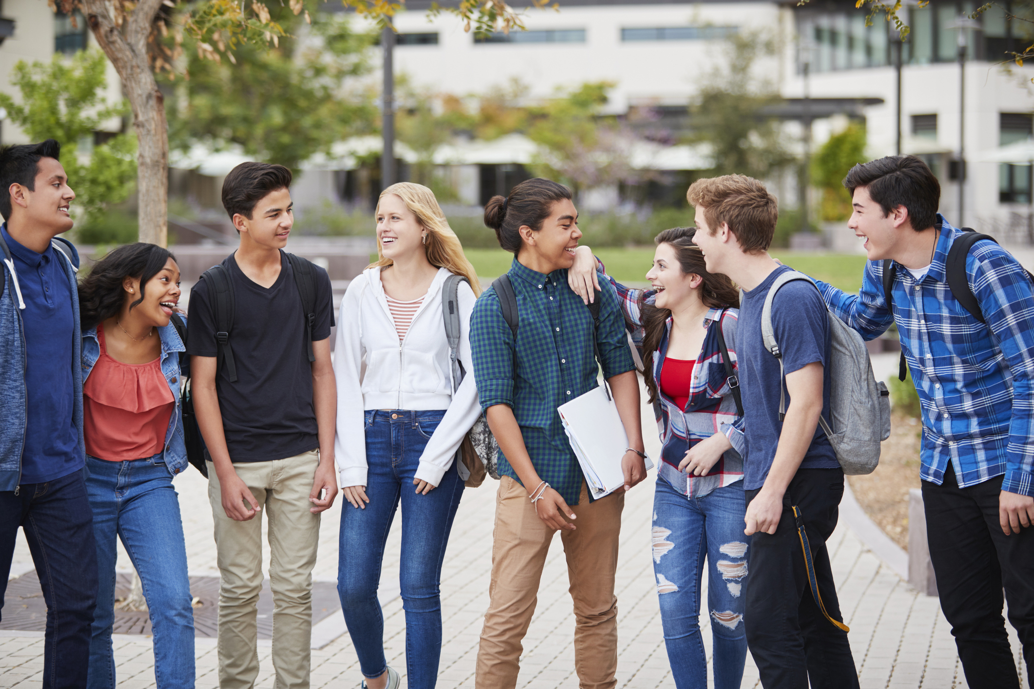 group of highschool students socializing 