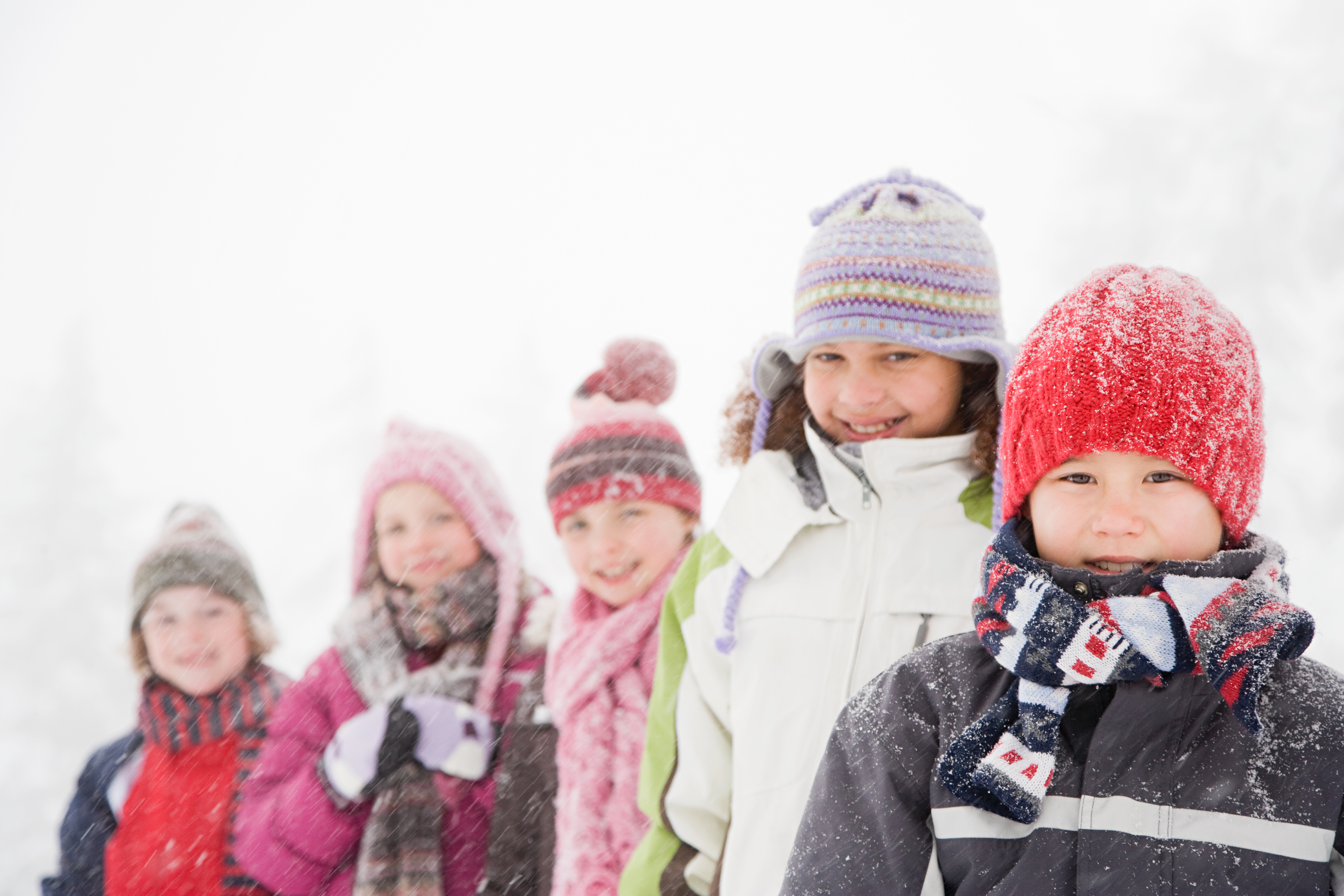 elementary students standing outside in snow
