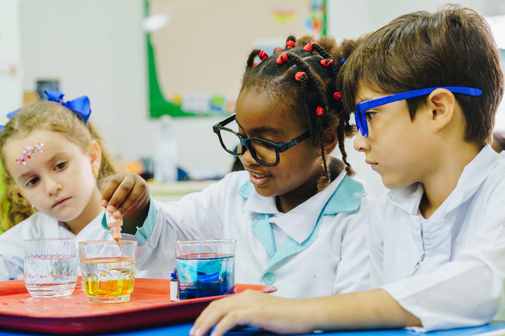 elementary students studying science classroom