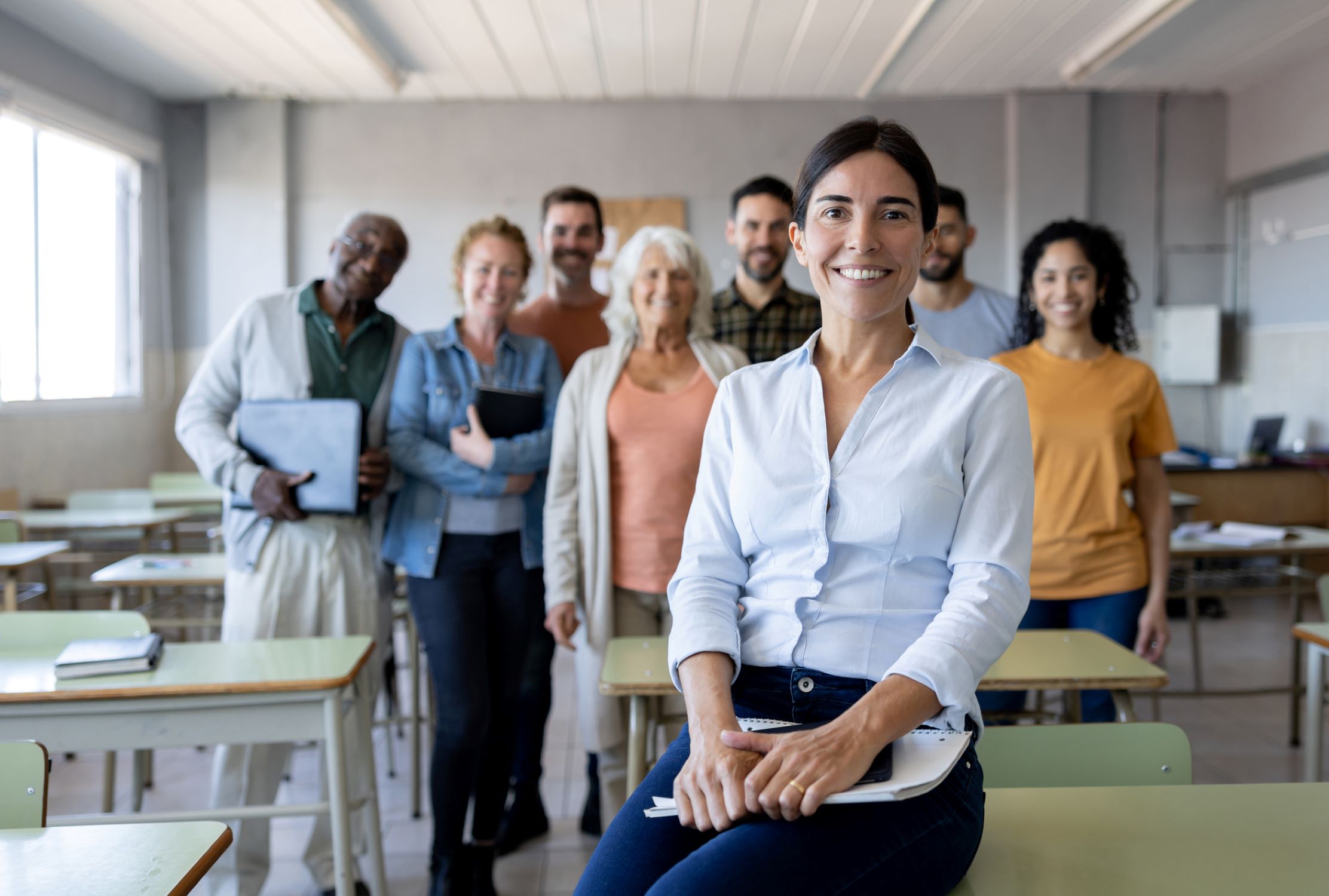group of adults sitting in a classroom