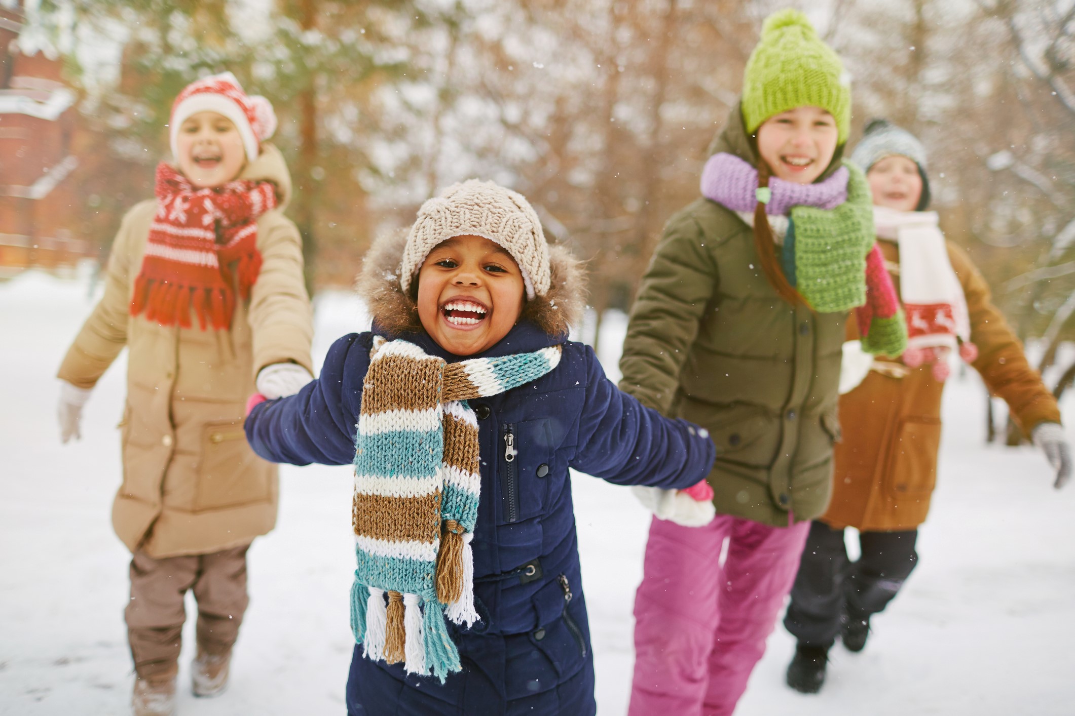 students playing outdoor in the snow