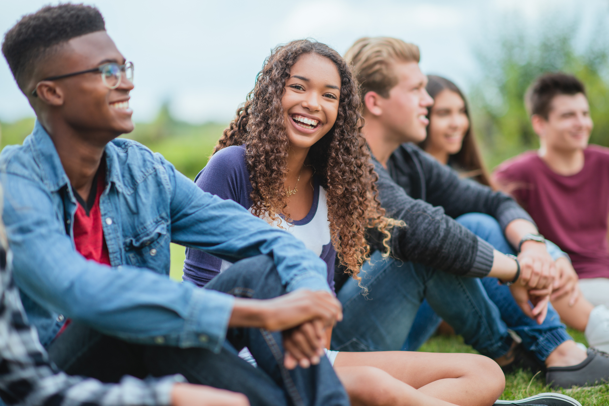 group of students sitting outdoors