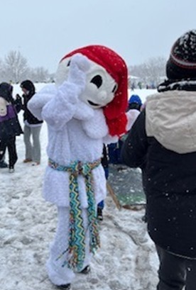 Image of an individual dressed up as a snowman with red sock hat