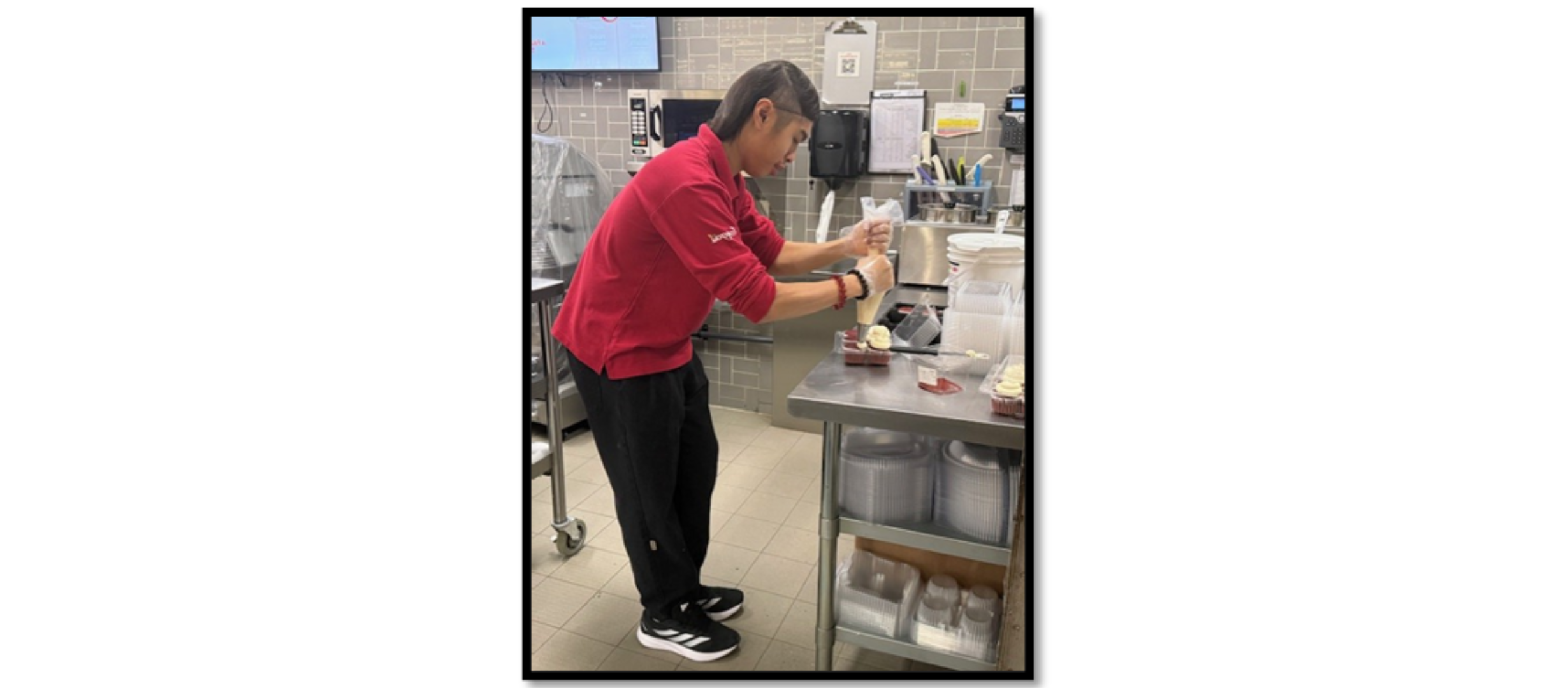 Photo of Titan working in the bakery at Longo's