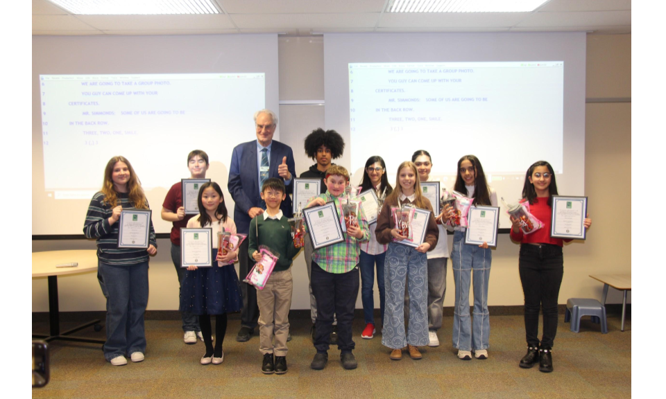 Group photo of the Communication Contest participants holding their framed certificates.