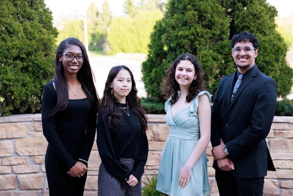 Group photo of the four Human Rights Ambassador Award winners