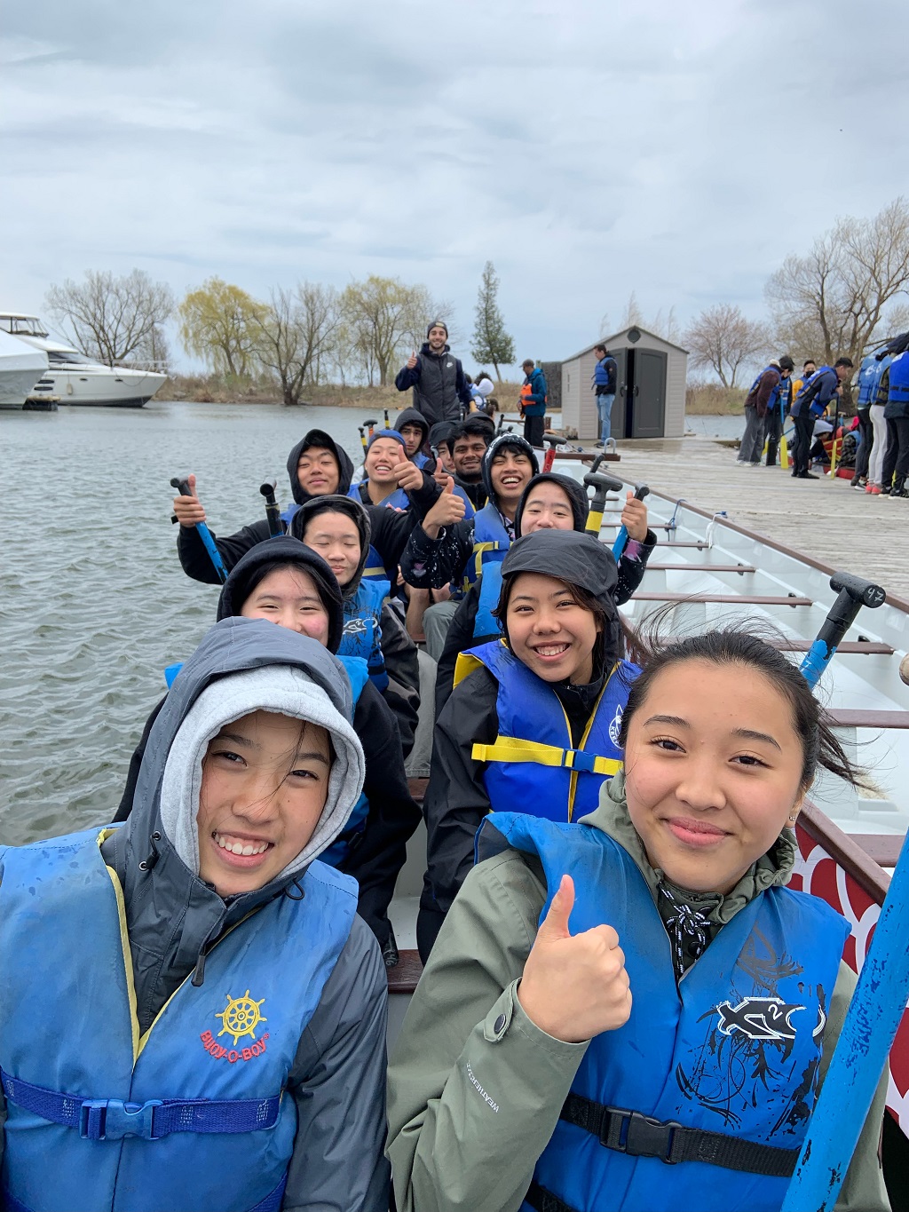 smiling students in boat