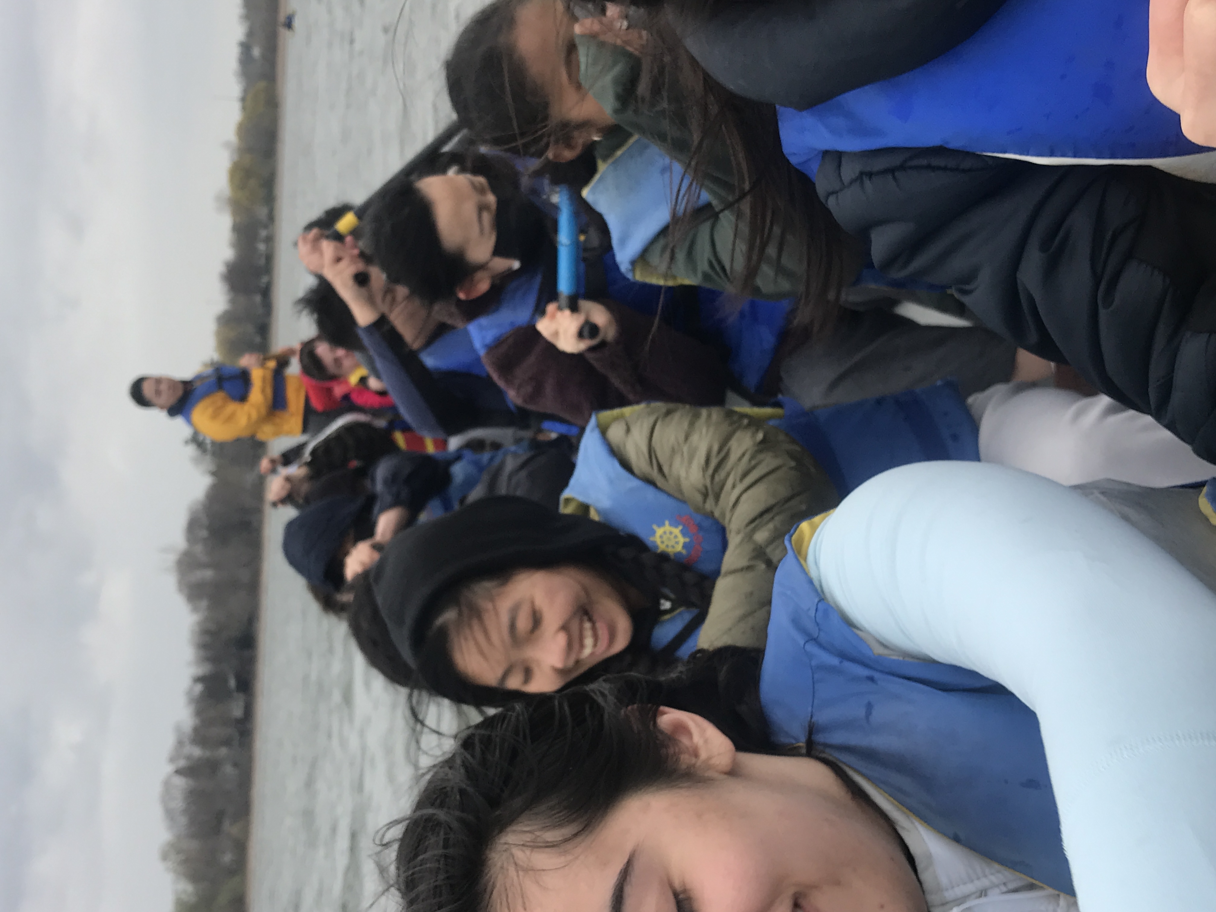 smiling students in boat