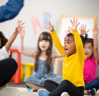 Students with hands up