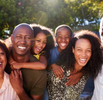 Black family smiling for a photo
