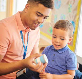 teacher with a young elementary student