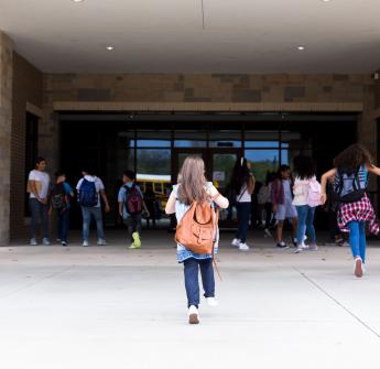 Students walking up to school building