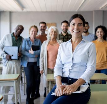 group of adults sitting in a classroom