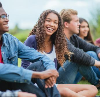 group of students sitting outdoors