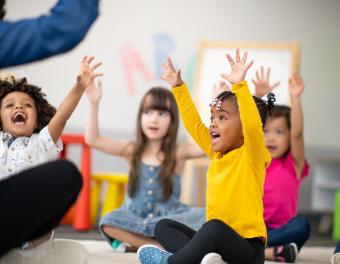 Students with hands up