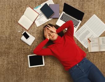 Student with books and technology