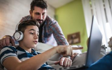 Student and parent on laptop