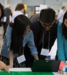 Students looking at computer