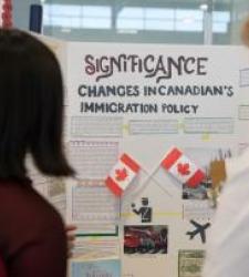 People looking at project about changes in Canada's immigration policy