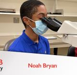 Student looking in microscope