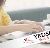 Student typing at a keyboard