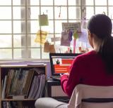 Secondary student sitting at a laptop