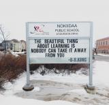 School sign reading Nokiidaa Public School, and BB King quote "The beautiful think about learning is nobody can take it away from you."