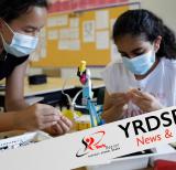 Two students work on STEM project