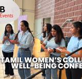 Group of students speaking by a stage