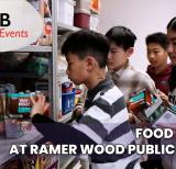 Group of students stand by shelves of food sorting it