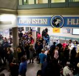 Crowd of people in school foyer