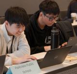 Two students work at a table. Sign reads Parkview Public School.