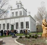 white building with students in front of it